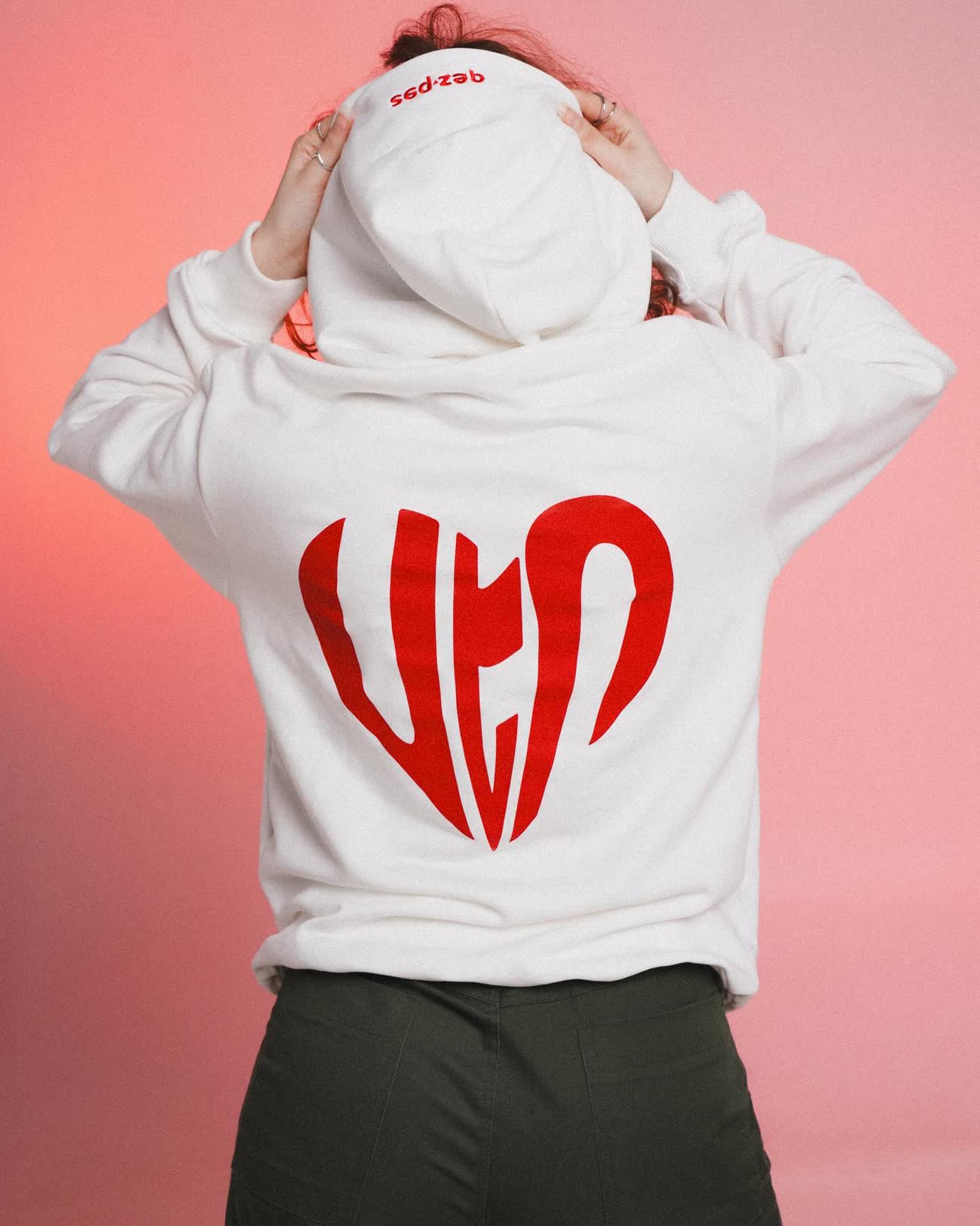 The first-drop hoodie «սեր» — a red heart-shaped “love” across the back